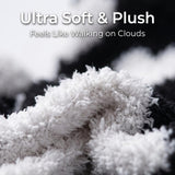 Close-up of a plush, ultra-soft fabric in white and black with overlaid text reading 'Ultra Soft & Plush' and 'Feels Like Walking on Clouds'.