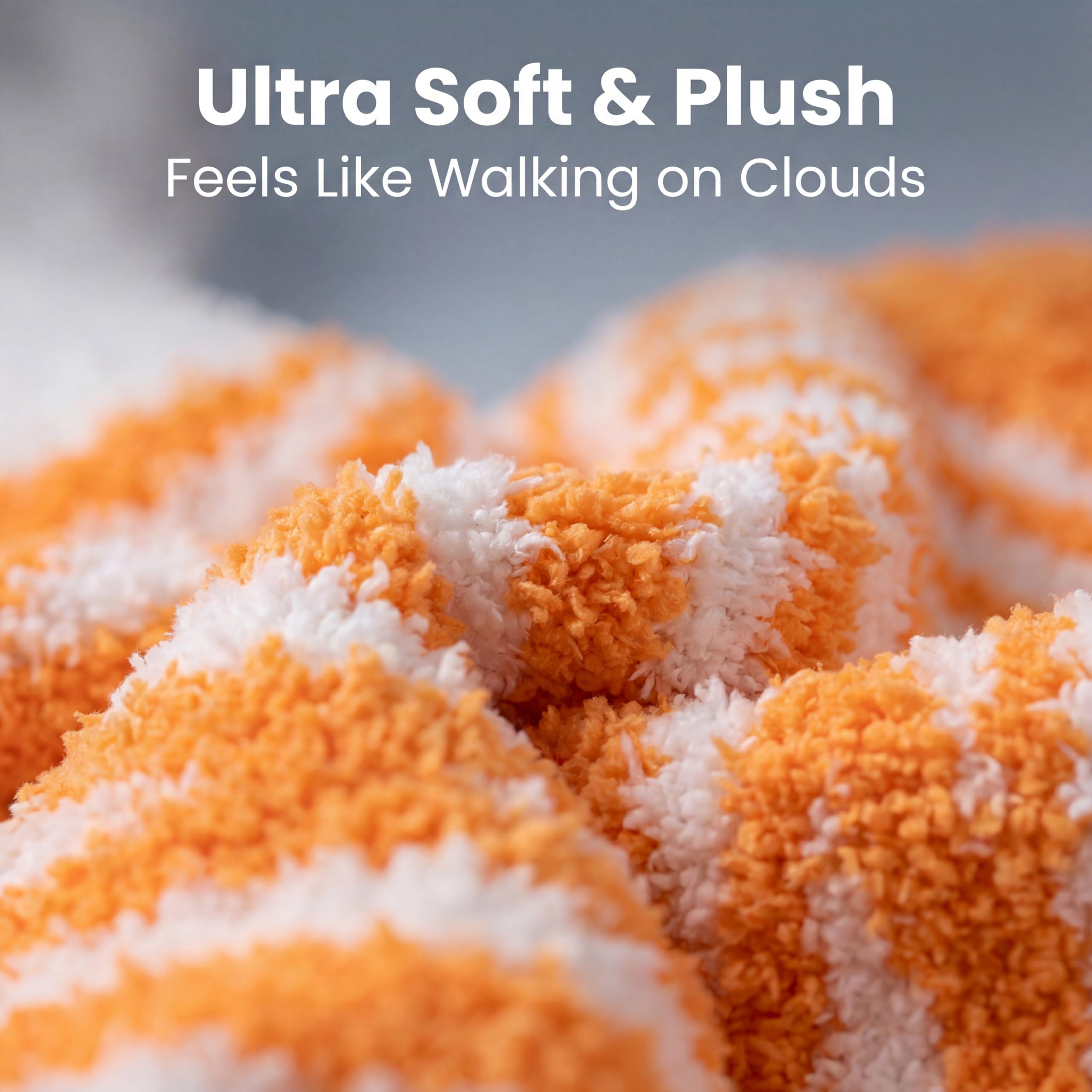 Close-up of a plush, ultra-soft orange and white striped blanket with text overlay reading 'Ultra Soft & Plush' and 'Feels Like Walking on Clouds'.