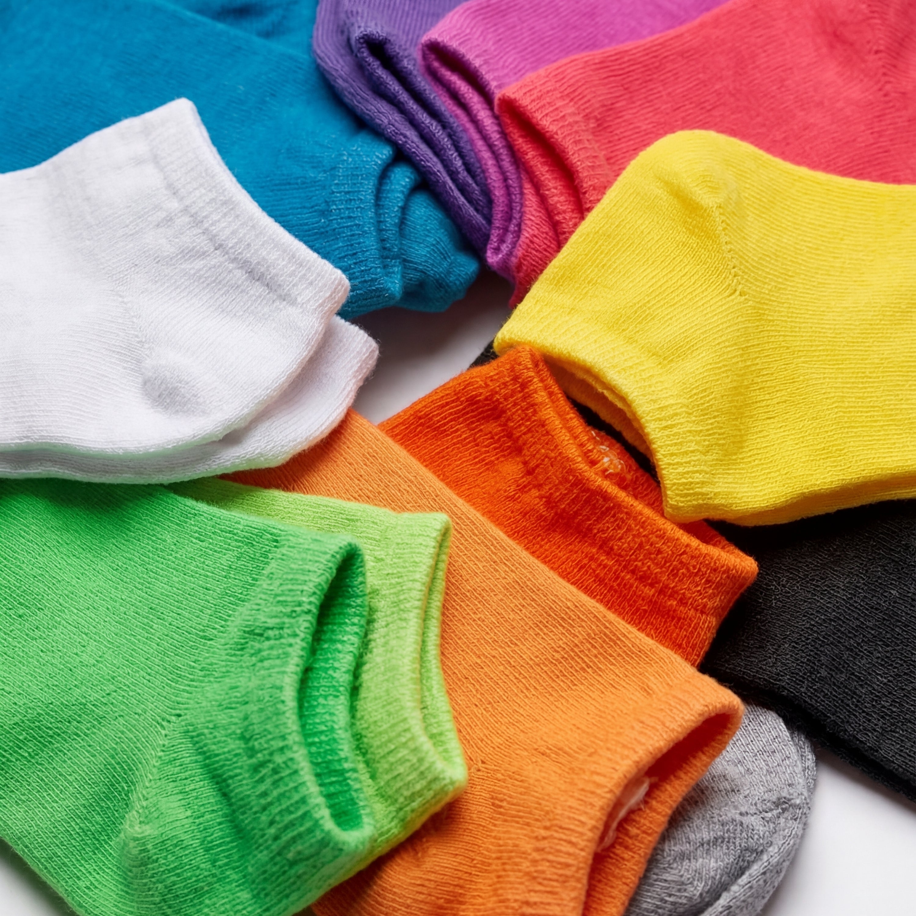 Colorful socks arranged in a circular pattern on a white background