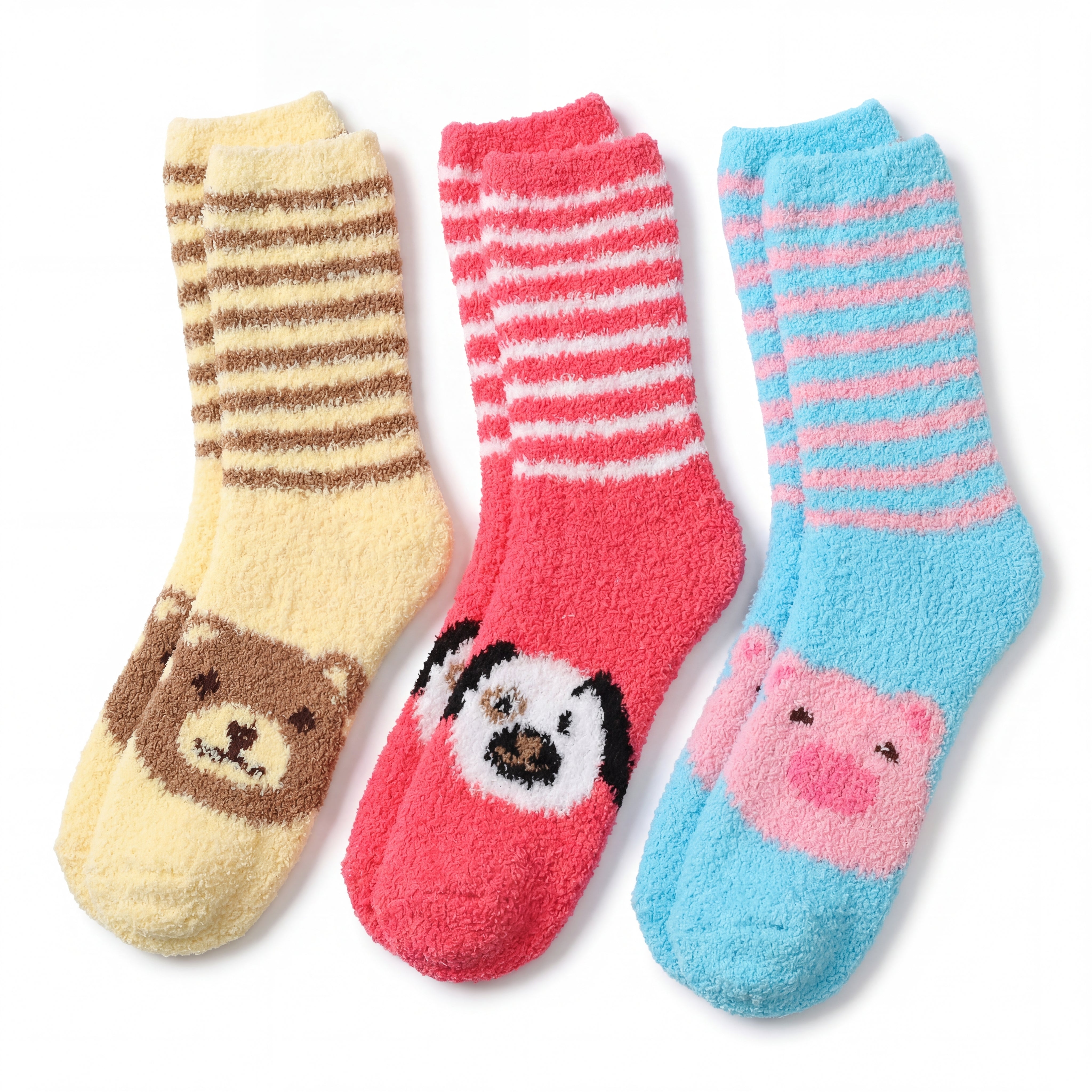 Three pairs of colorful socks with animal faces on a white background