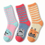 Three pairs of striped socks with animal faces on a white background