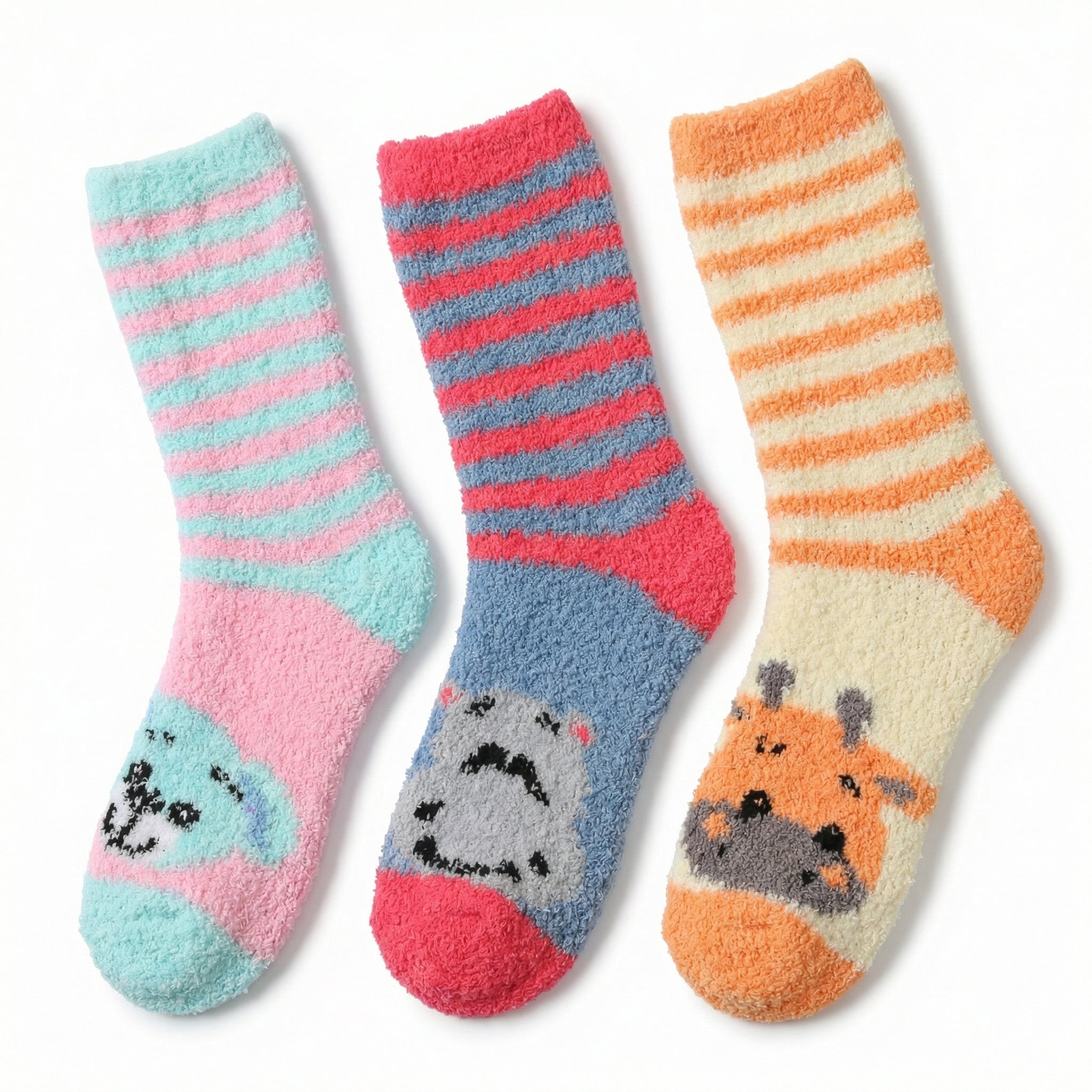 Three pairs of striped socks with animal faces on a white background