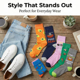 Colorful socks with various designs on a wooden surface with jeans and sneakers.
