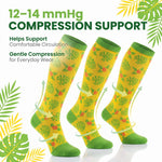Three yellow compression socks with green tropical leaf and flower patterns, shown on a white background with promotional text and leaf graphics.