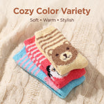 Stack of colorful socks with bear design on a textured fabric background