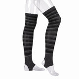 Black and gray striped over-the-knee compression socks shown on a clear mannequin leg form against a white background.