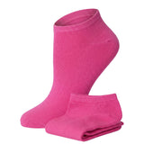 Pair of pink ankle socks on a white background