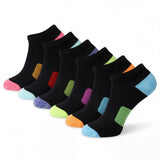 Set of black ankle socks with colorful heel and toe accents on a white background
