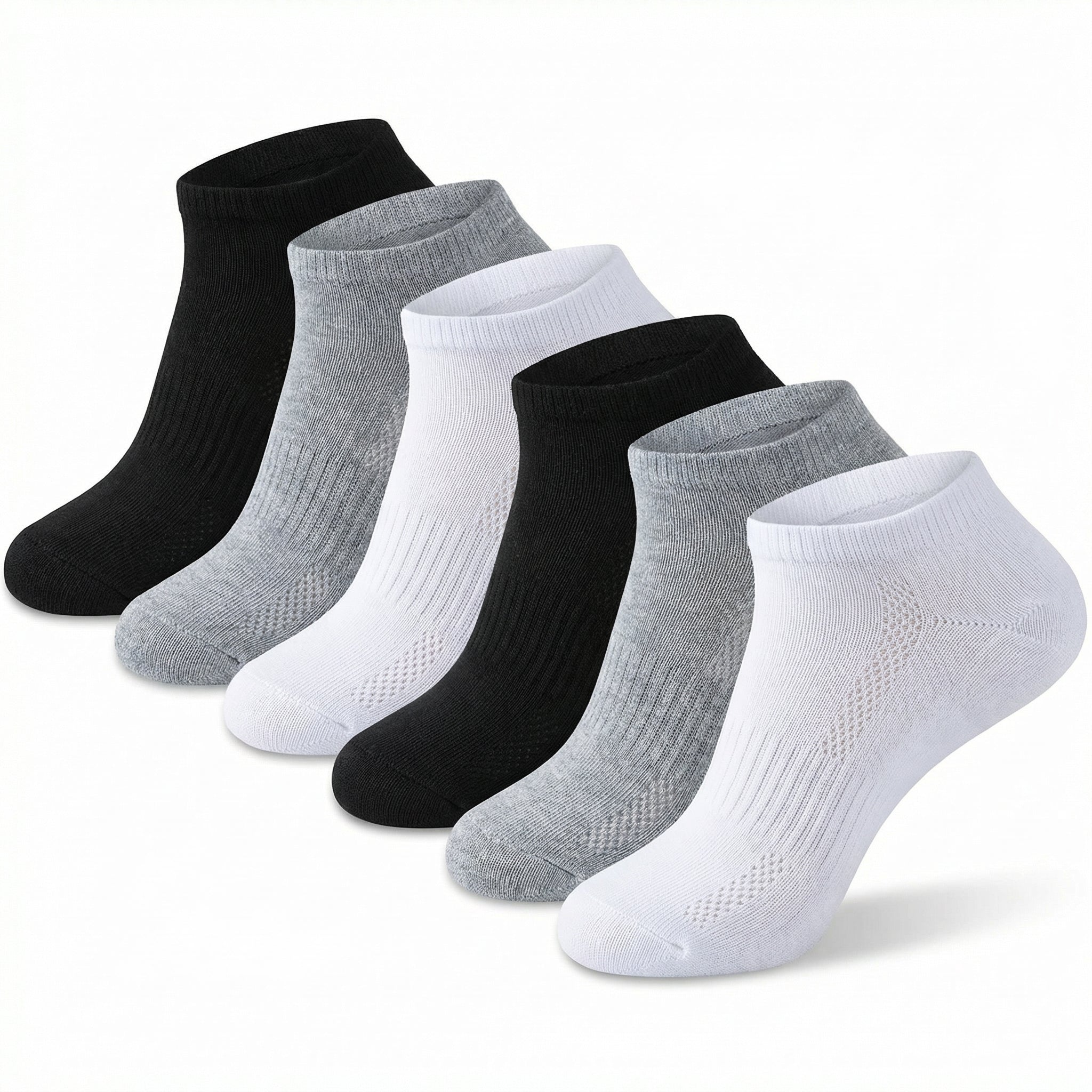 Set of black, gray, and white socks on a light gray background