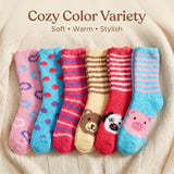 Set of colorful children's socks with various patterns on a beige background.