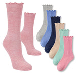 Set of colorful socks with ruffled edges on a white background