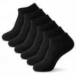 Set of six black ankle socks on a white background