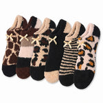 Set of six patterned socks with bows on a white background