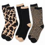 Set of three pairs of socks with leopard print, black and beige, and striped patterns on a white background.