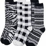 Set of three patterned socks on a white background