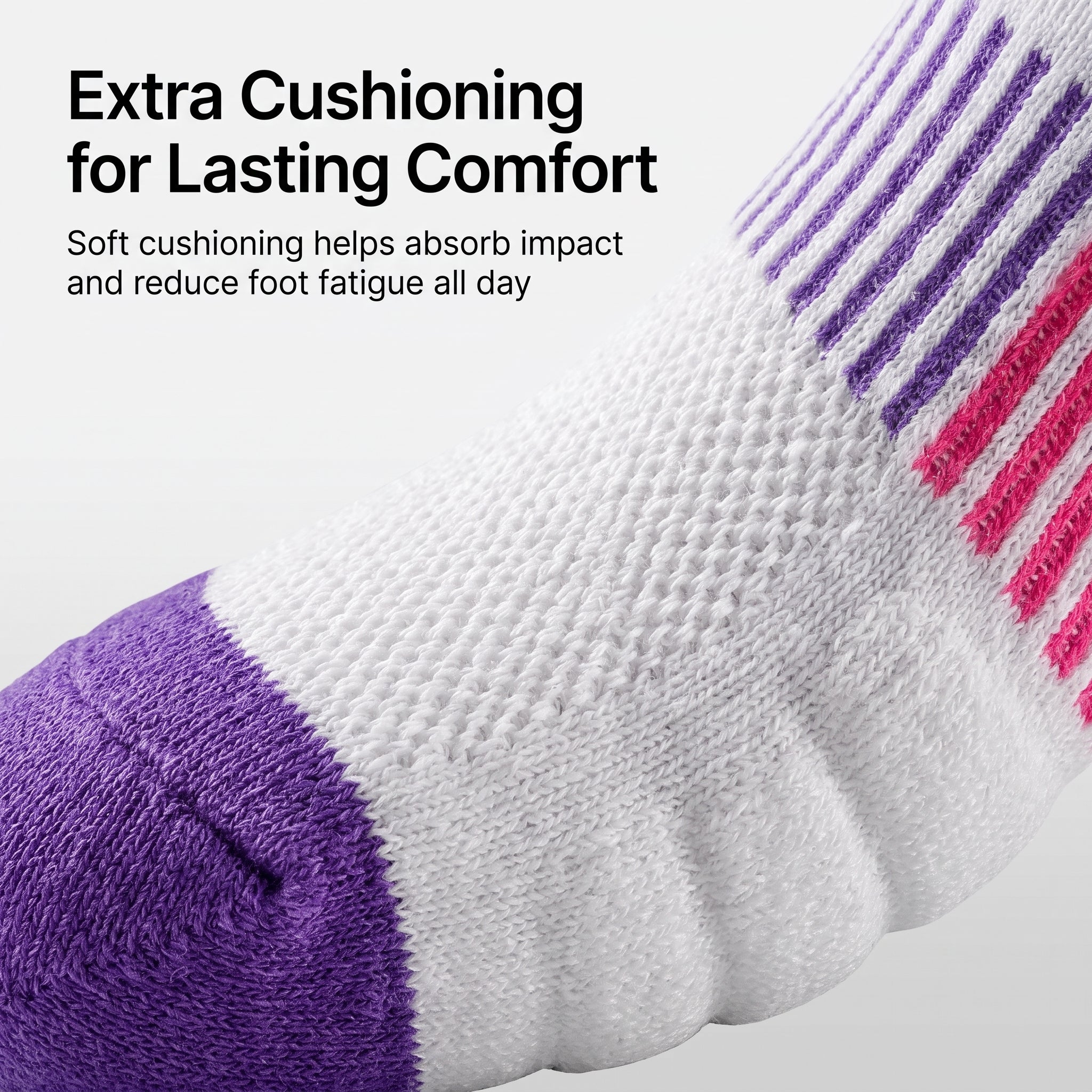 A close-up of a white athletic sock with purple toe and heel sections, purple and pink striped ribbing at the cuff, and promotional text reading 'Extra Cushioning for Lasting Comfort' on a light gray background.