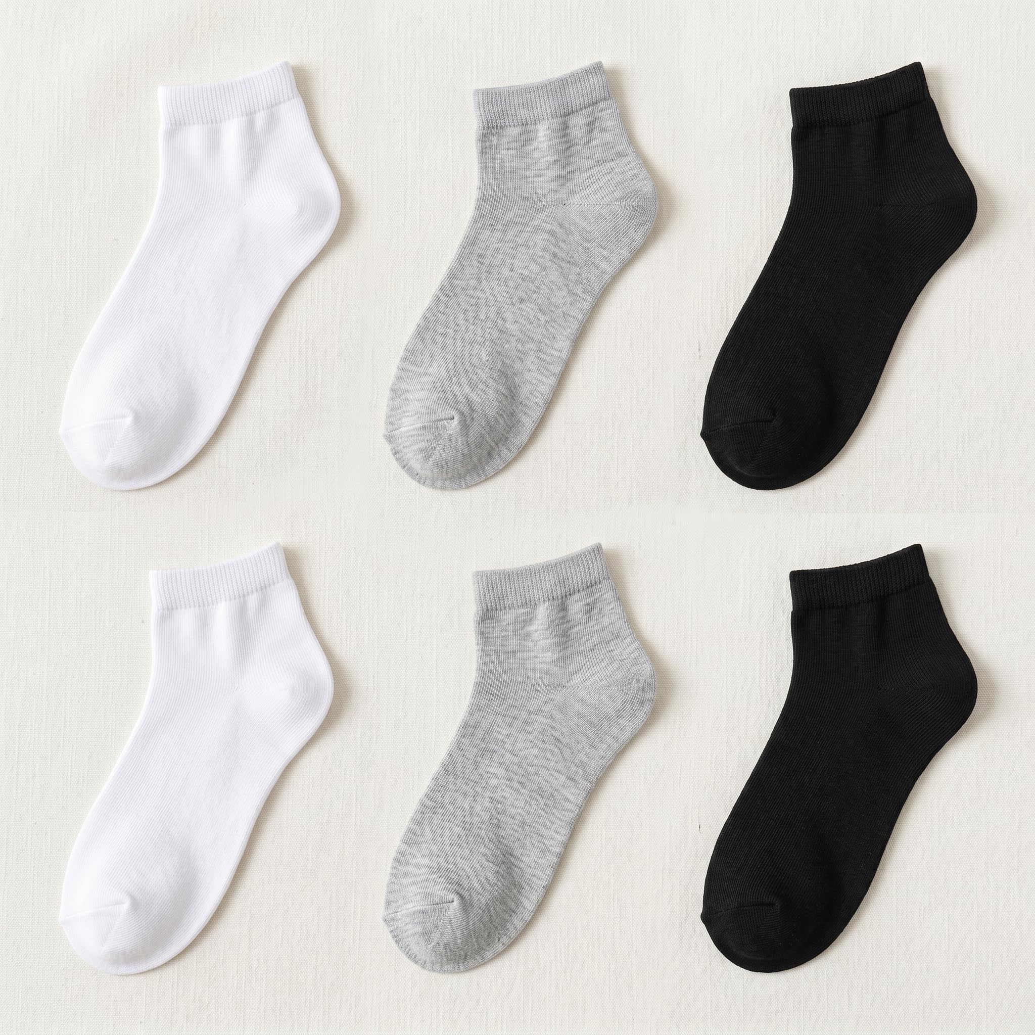 Six ankle socks arranged in a 2x3 grid on a light beige fabric background, showing white, light heather gray, and black options.
