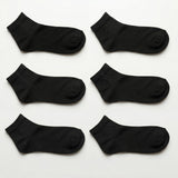 Six black ankle socks arranged in two columns of three on a plain white background.