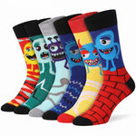 Six pairs of crew socks with colorful cartoon monster designs, arranged in a fan shape on a white background.