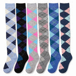 Six pairs of knee-high argyle socks displayed side-by-side against a white background, featuring various color combinations including blue, pink, gray, black, and navy.