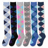 Six pairs of knee-high argyle socks displayed side-by-side against a white background, featuring various color combinations including blue, pink, gray, black, and navy.