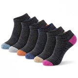 Six pairs of low-cut ankle socks arranged in a fan shape on a white background. The socks are primarily dark charcoal gray with various accent toe and heel colors including pink, orange, blue, beige, and light gray.