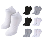 Six pairs of low-cut ankle socks shown on a plain white background: two white pairs large on the left and four smaller pairs arranged to the right, including black, light gray, and white variants.