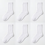 Six pairs of plain white crew socks arranged in a 2x3 grid on a clean white background.