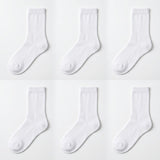 Six pairs of plain white crew socks arranged in a 2x3 grid on a clean white background.