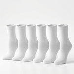 Six pairs of plain white crew socks arranged in a row on a clean white background.