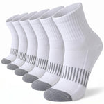 Six pairs of white low-cut athletic socks with gray toes and heels, arranged in a diagonal row on a white background.