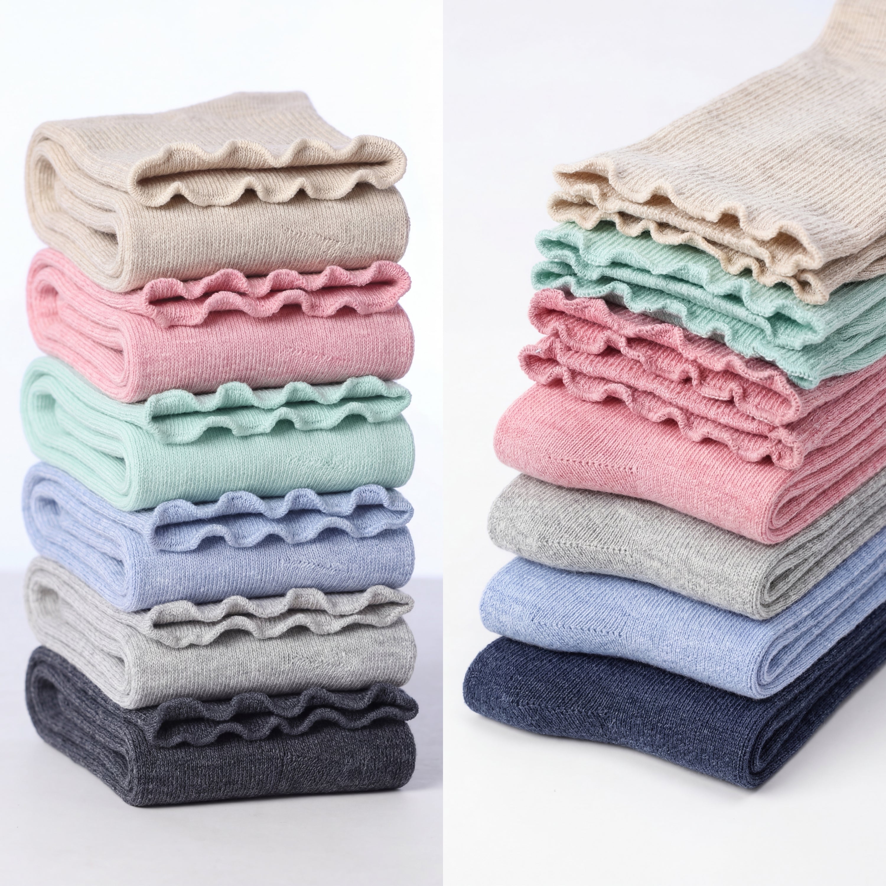 Stacks of folded ruffled fabric in various colors on a white background