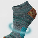 Textured sock with targeted arch support on a light gray background