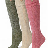 Three knee-high ribbed socks in olive green, cream, and dusty pink, each featuring two decorative buttons near the cuff, displayed against a plain white background.