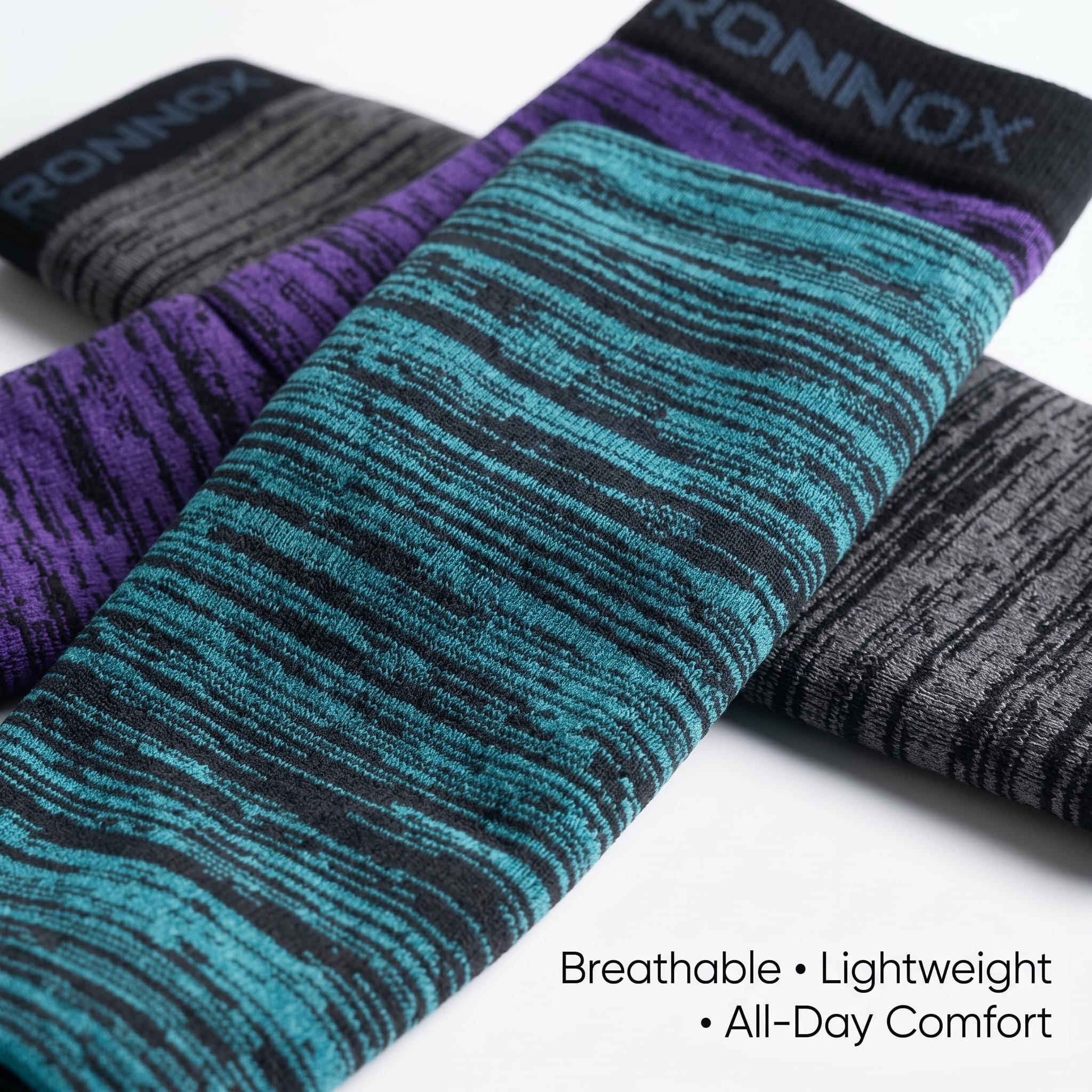 Three pairs of athletic arm warmers with a heathered stripe pattern, shown overlapping on a white background. The visible colors are teal and black, purple and black, and gray and black.
