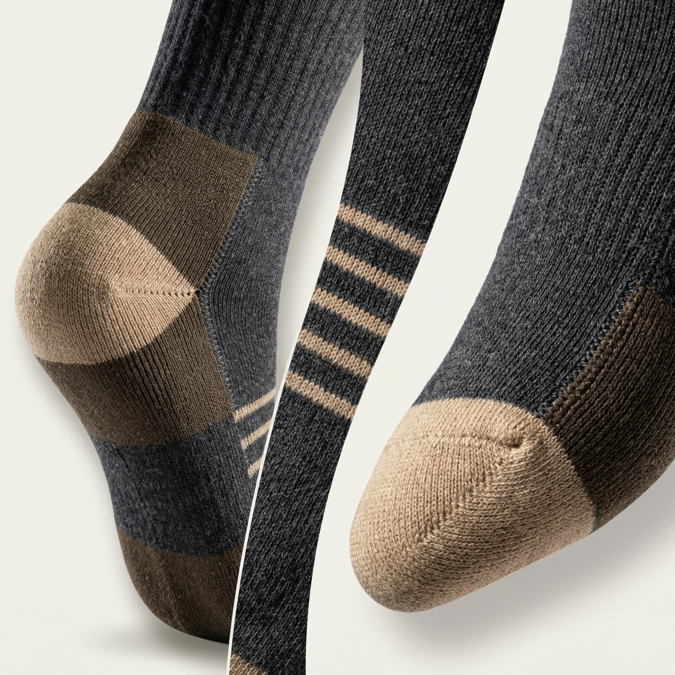 Three pairs of crew socks shown in a close-up studio arrangement on a light neutral background. The socks are dark charcoal gray with tan/beige toe, heel, and cuff sections, plus thin beige stripes on one pair.