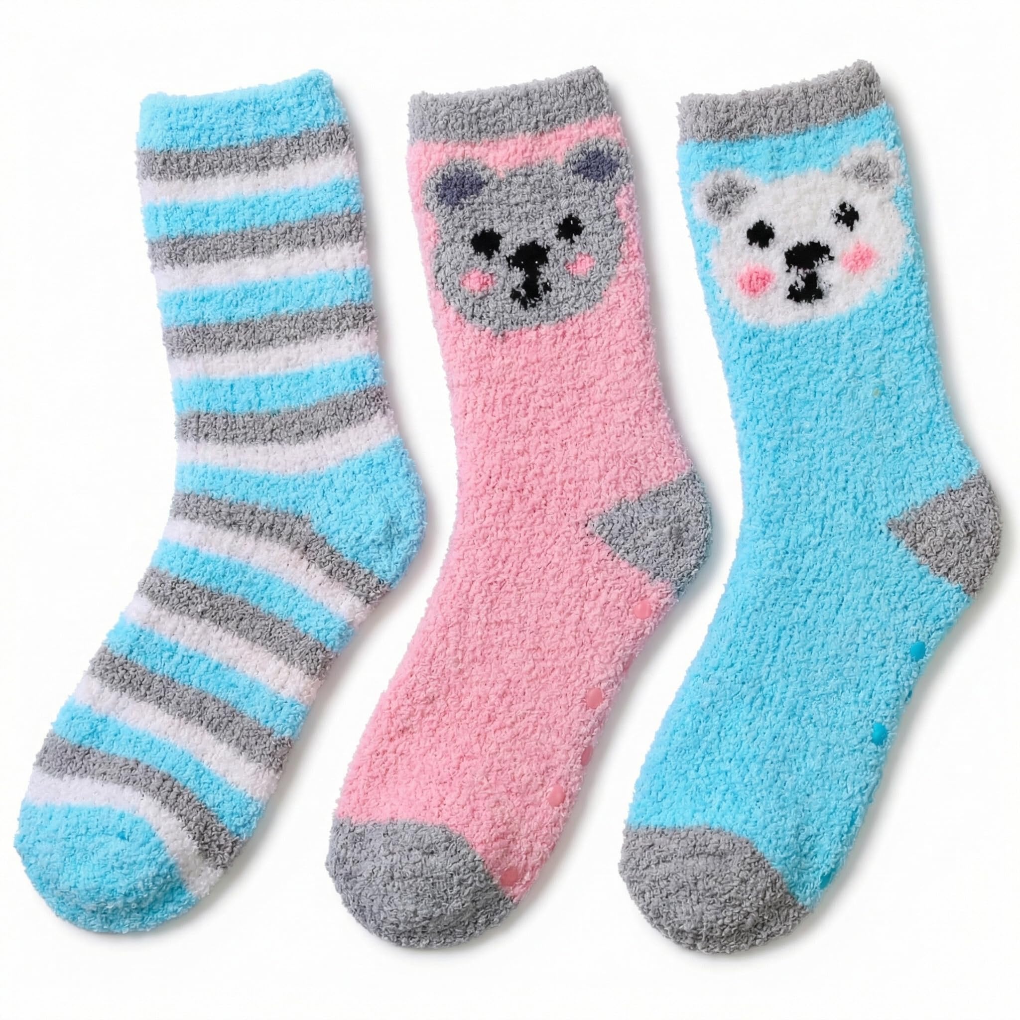 Three pairs of fuzzy crew socks shown together on a white background: one blue and gray striped sock, one pink sock with a gray bear face, and one light blue sock with a white bear face.
