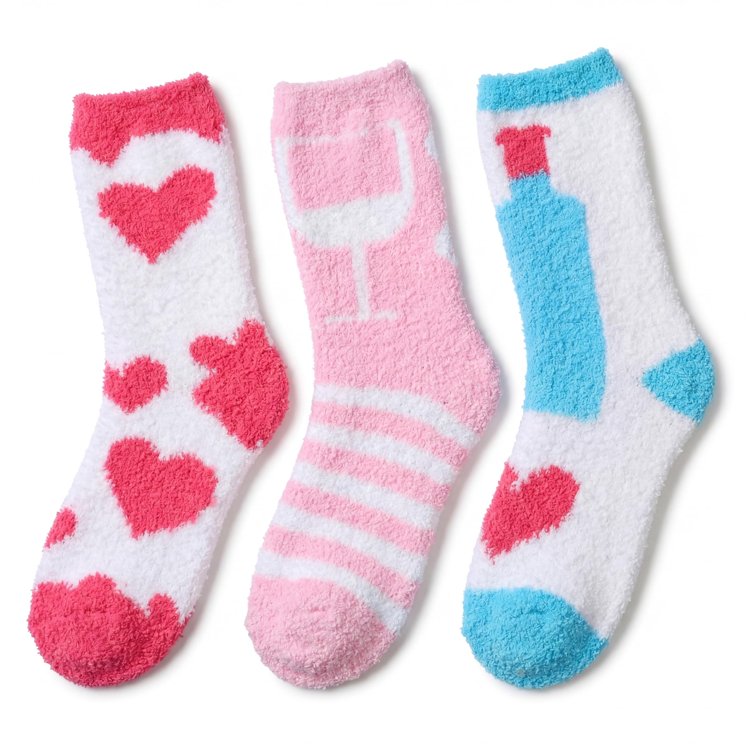 Three pairs of fuzzy socks arranged side by side on a white background. The left pair is white with red hearts, the middle pair is pink with a wine glass pattern and light pink stripes, and the right pair is white with a blue bottle design and red heart accents.