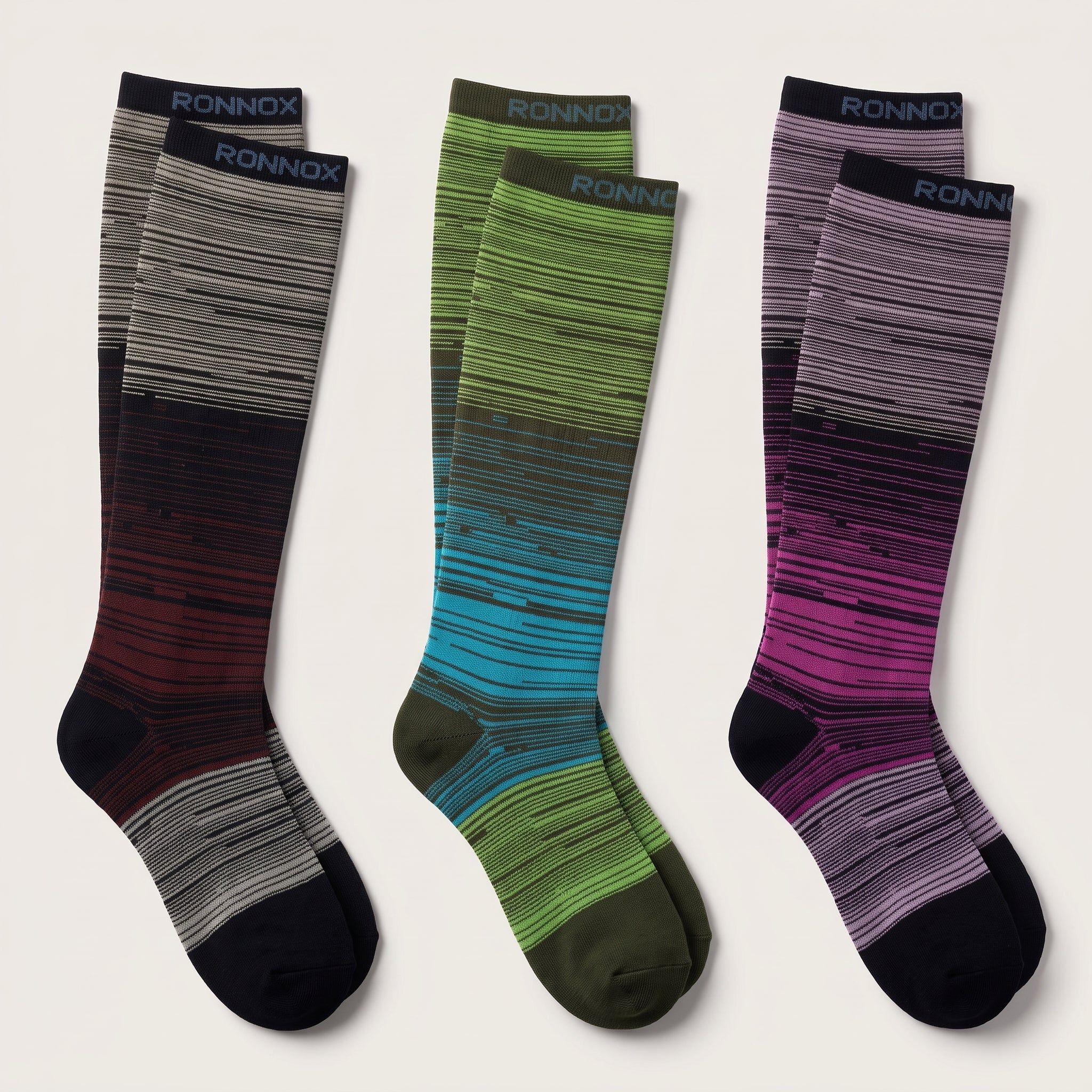 Three pairs of knee-high socks by Ronnox with horizontal striped gradient patterns, displayed on a light beige background. The left pair transitions from gray and black to dark red and black.