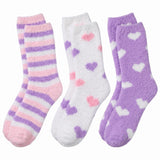 Three pairs of soft socks with different patterns on a white background