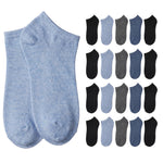 Two heather light blue ankle socks displayed prominently on the left, with a grid of 16 smaller ankle socks in various colors (black, light blue, gray, navy) arranged on the right, all on a plain white background.