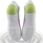 White socks with green cushioned sole on a white background