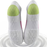 White socks with green cushioned sole on a white background
