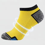 Yellow ankle sock with targeted arch support on a light gray background