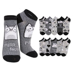 A set of low-cut socks featuring a cat-themed design. The main pair on the left is heather gray with black cuffs, heels, and toes, decorated with a cartoon cat wearing glasses and the text 'PURR.