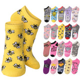 A pair of yellow low-cut socks with a repeating bumblebee pattern, shown next to a grid of multiple other colorful sock designs featuring bees, bunnies, bears, and text slogans.